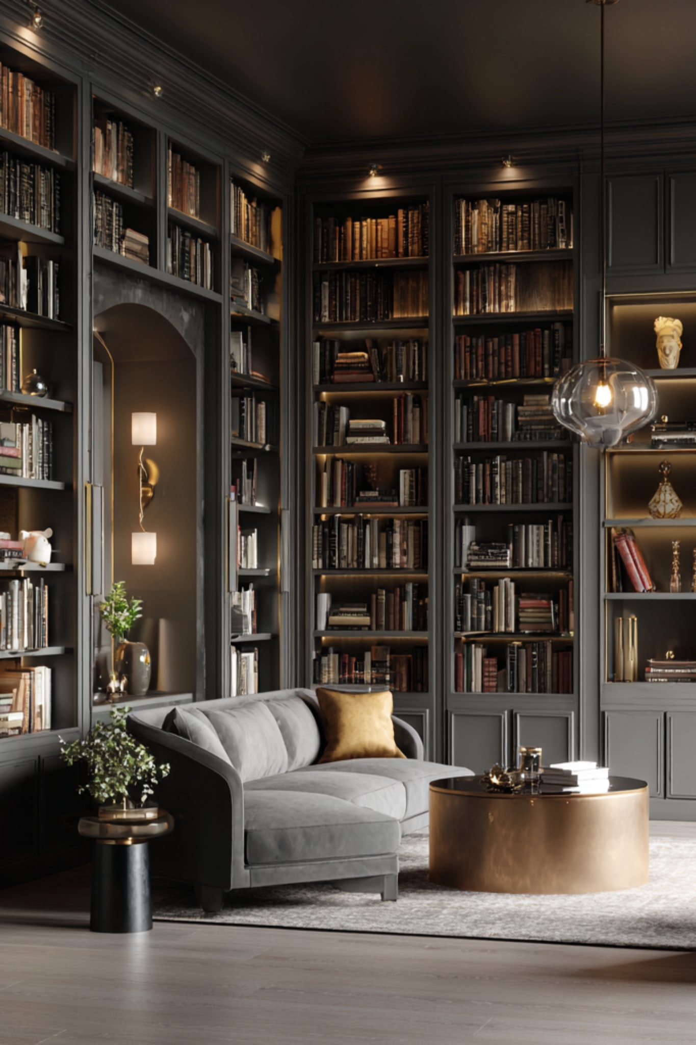 a room with bookshelves all around and a sofa and table for Vale & Vine Press